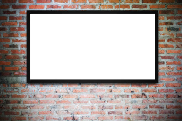 istock Blank advertising billboard or wide screen television with blur background 1299562041