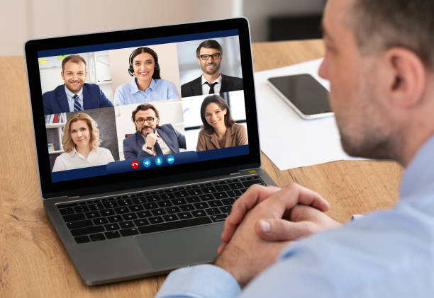 istock Businessman Talking With Employees Via Online Video Call In Office 1299562043