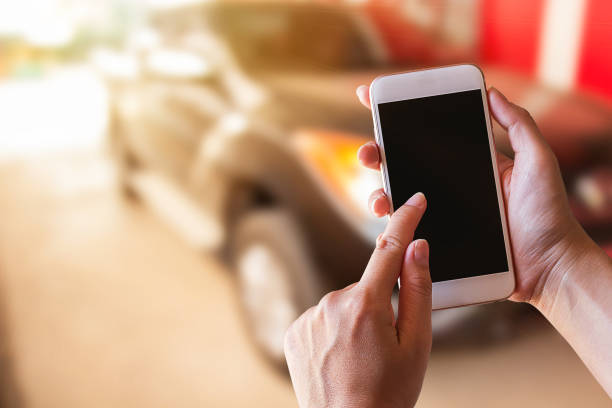 istock Businessman holding smartphone with blurred background 1299562087