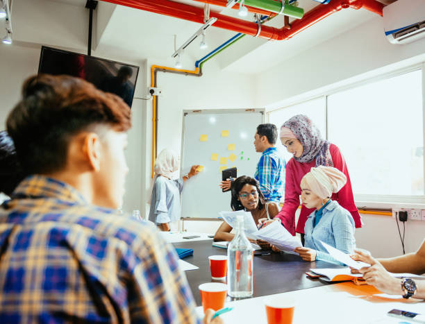 istock Multi ethnic business team building new post-covid market strategy 1299562257