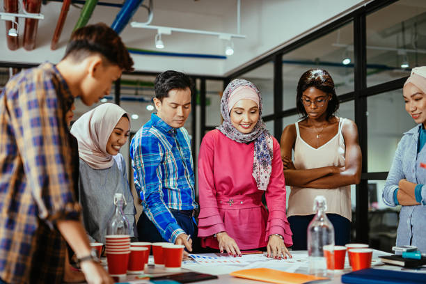 istock Multi ethnic diverse business team in office, teamwork on new post-covid project 1299562445