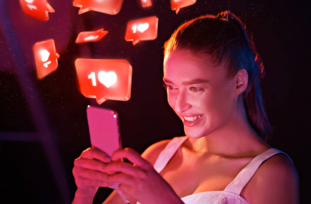 istock Happy Woman Using Smartphone With Like Buttons Standing Indoors, Collage 1299563126