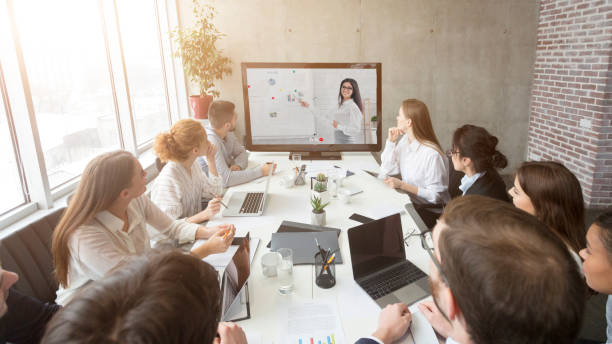 istock Business Team Having Online Meeting In Office, Making Video Call 1299563292
