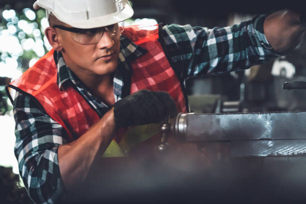 istock Smart factory worker or engineer do machine job in a manufacturing workshop 1299565918