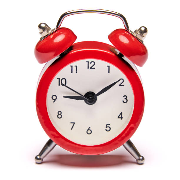 istock Red vintage alarm clock isolated on white background with clipping path 1299566338