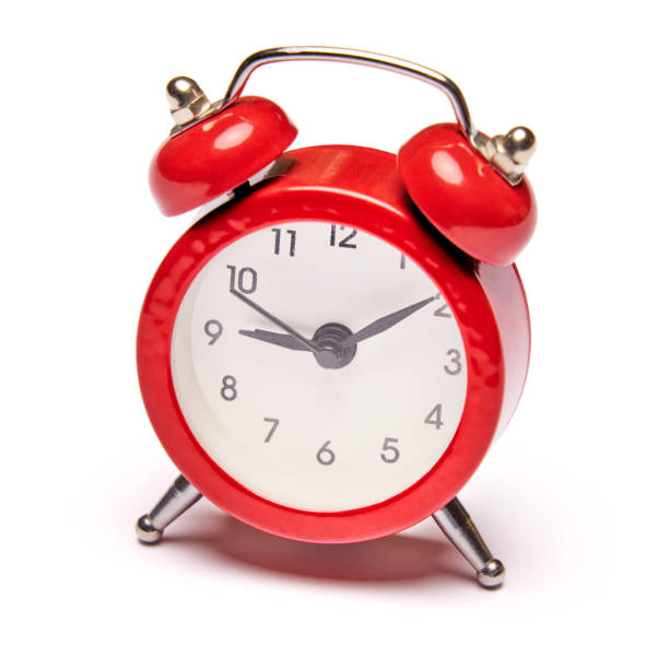 istock Red vintage alarm clock isolated on white background with clipping path 1299566341