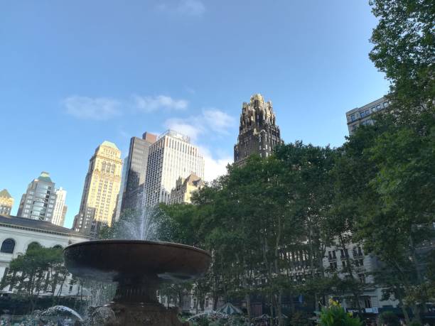 istock Fountain with modern building in the background 1299567397