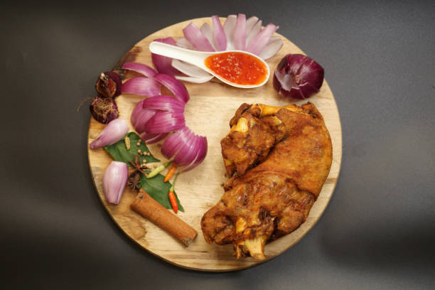 istock Top view deep fried pork leg on wooden board 1299568523