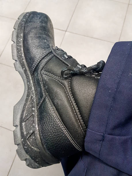 modern reinforced black boot for risk jobs stock photo