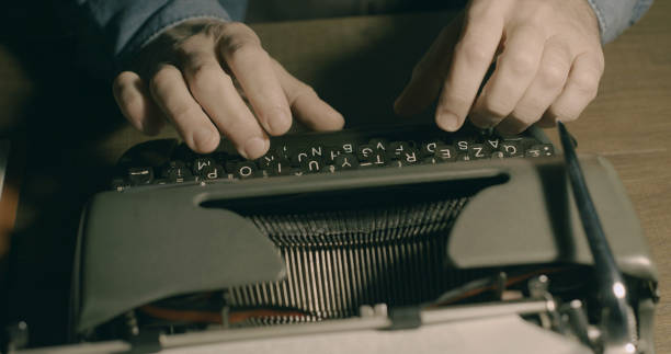 istock Businessman typing on a vintage typewriter 1299570577