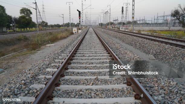 Long Straight Railroad From Rusty Rails On Concrete Sleepers In A Rural Area In The India Cement Sleeper Or Block Lay On The Pebbles Stock Photo - Download Image Now