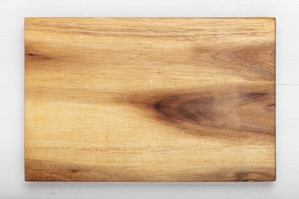 istock Cutting wooden board of rectangular shape on a wooden background.  Space for text. 1299571748
