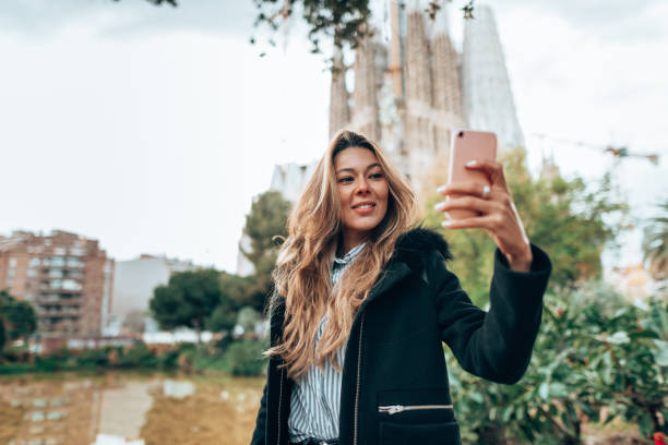 istock woman take a selfie in barcelona 1299575138