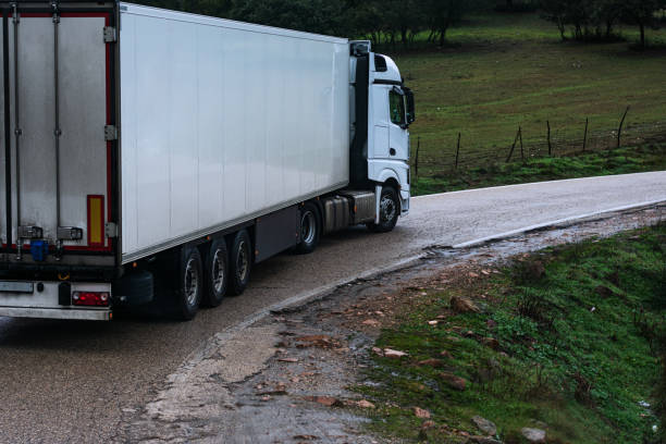 istock Trailer cornering on a narrow road. 1299575151