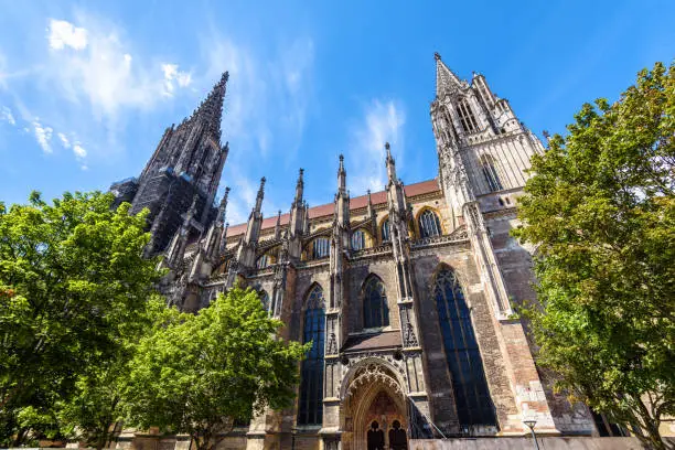 Ulm Minster or Cathedral of Ulm city, panorama of ornate Gothic church exterior, Germany. It is famous landmark of Ulm. Scenery of medieval European architecture in old town in summer.
