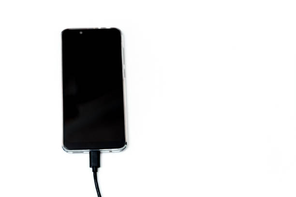 istock Charging your smartphone from a portable charger, close-up. 1299577187