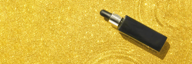 istock Water circle with sparkles background. Black serum bottle. Copyspace mockup 1299578702