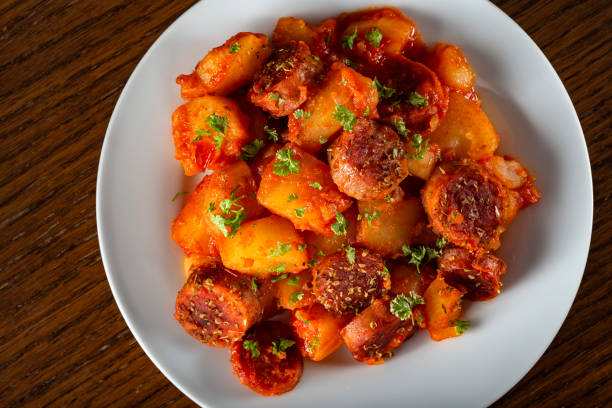 istock Potatoes stew with pork sausages 1299580509