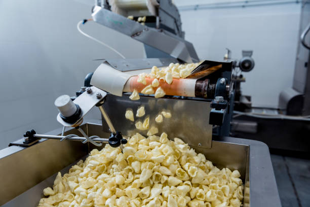 istock Conveyor line for packing snacks and chips in a modern factory 1299580523