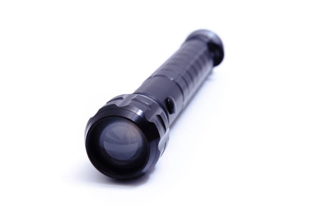 Black big LED flashlight photographer on a white background.