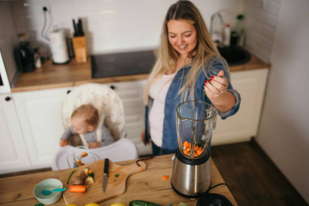 istock young mother is feeding her baby 1299582001