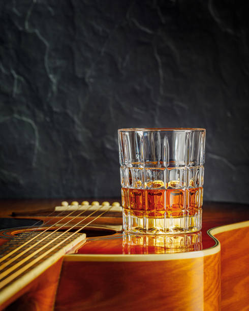 istock still life with whiskey and acoustic guitar 1299582102