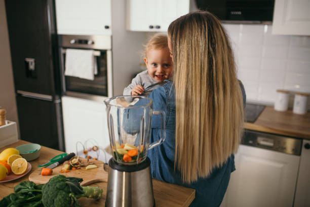 istock young mother is feeding her baby 1299582112