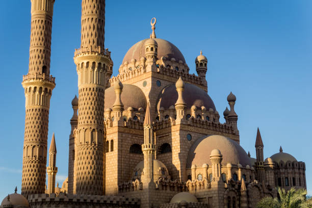 istock Beautiful large Islamic mosque at the sky background 1299582258