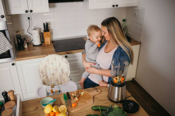 istock young mother is feeding her baby 1299582287