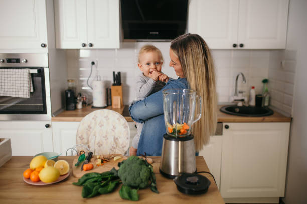 istock young mother is feeding her baby 1299582340