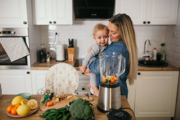 istock young mother is feeding her baby 1299582870