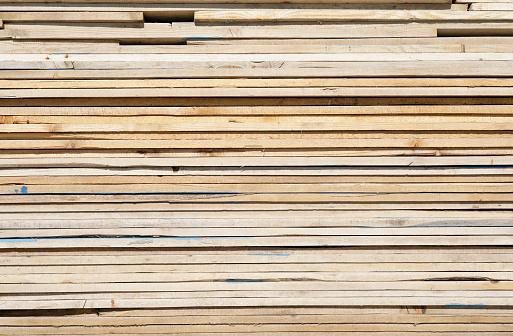 A stack of wood planks for use in construction