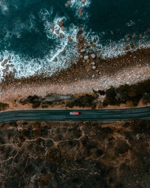 istock Lonely Coca-Cola truck along the rough coastline 1299584425