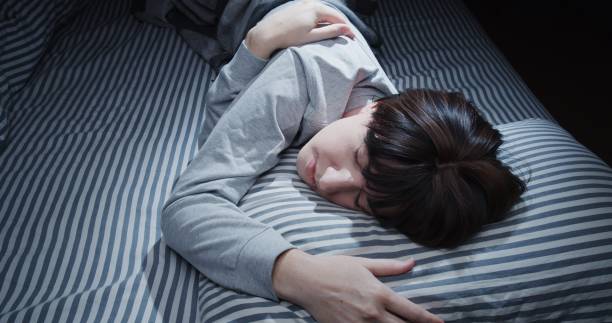 istock Mature woman is sleeping in bed 1299585340