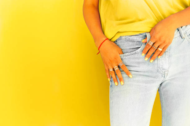 istock Crop woman in trendy clothes in studio 1299586285
