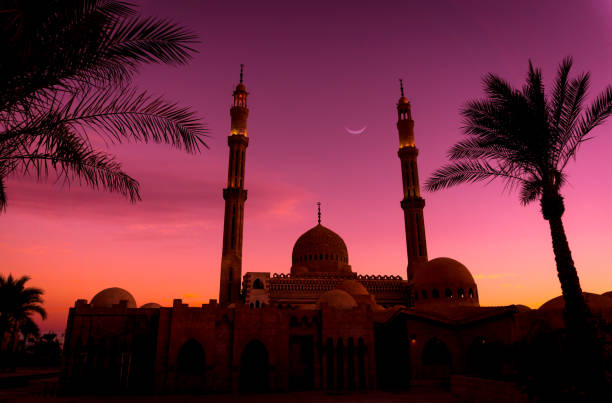 istock Beautiful large Islamic mosque at the sunset sky background 1299586297