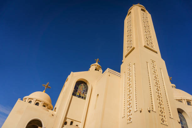 istock Public cathedral coptic egyptian church at the sky background 1299588579