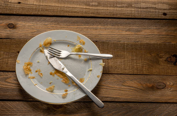 istock dirty dishes on wooden table 1299588840