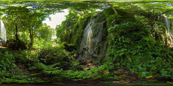 Waterfall in the green forest. Kawasan falls in the jungle, island of Bohol, Philippines. 360 panorama VR.