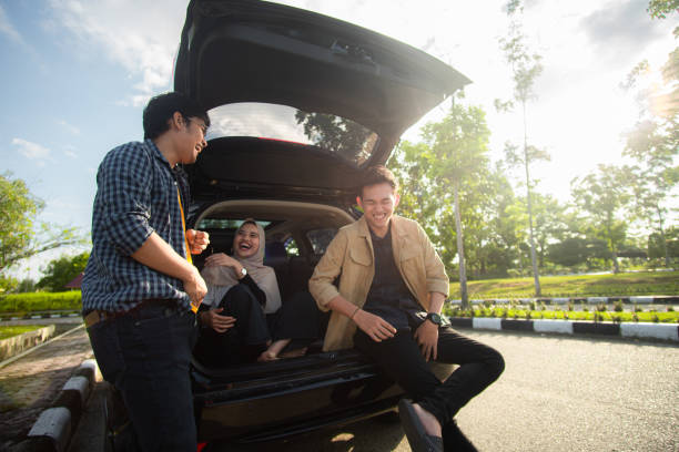 istock Group of People Talking outside the car 1299590293