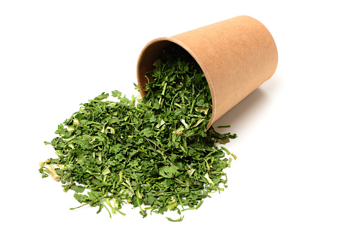 Heap of dry isolated coriander on white background