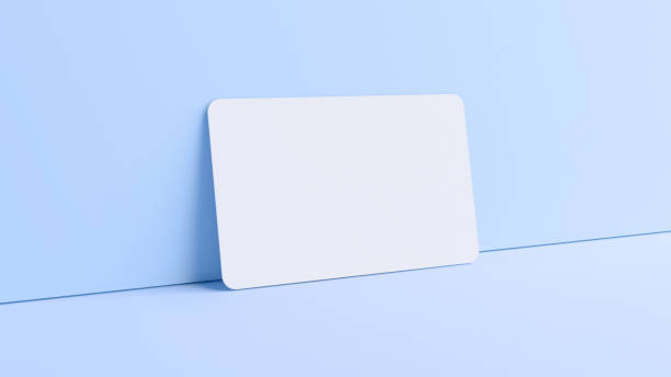 istock Blank credit card mockup resting on a wall in realistic 3D rendering. Rounded corners business card mock up for design template 1299591247