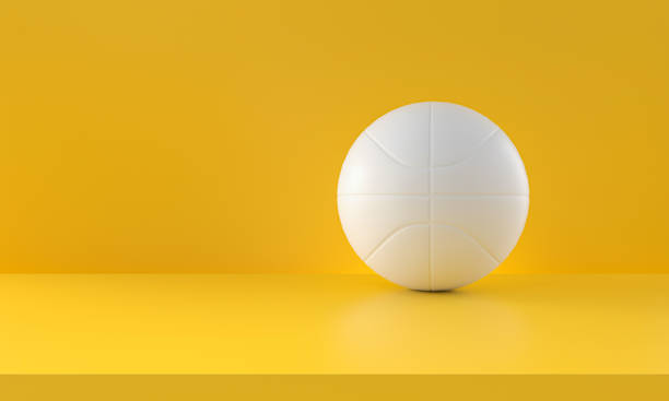 istock White basketball isolated from yellow background 1299591277