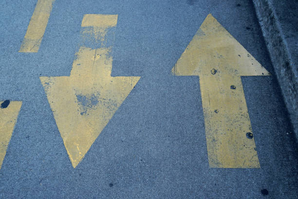 istock Road signs indicate that can walk two way together in san francisco USA 1299593139