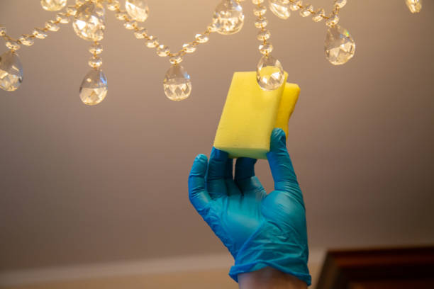 istock Cleaning with a sponge in a blue rubber glove 1299593757