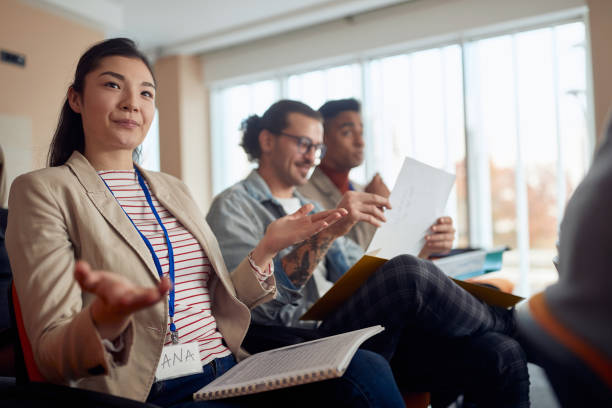 istock young asian female discussing at business conference 1299594067