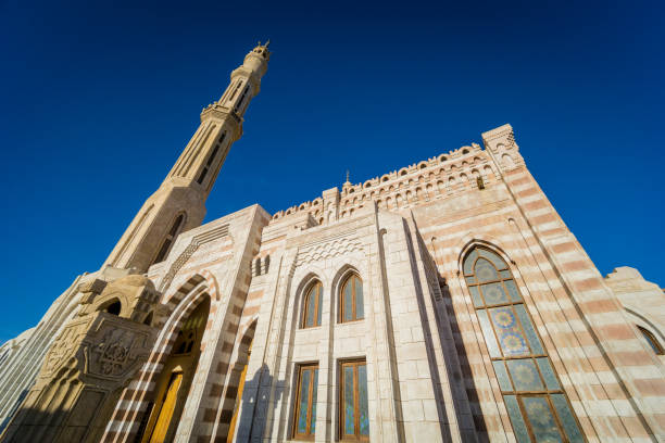 istock Beautiful large Islamic mosque at the sky background 1299594234