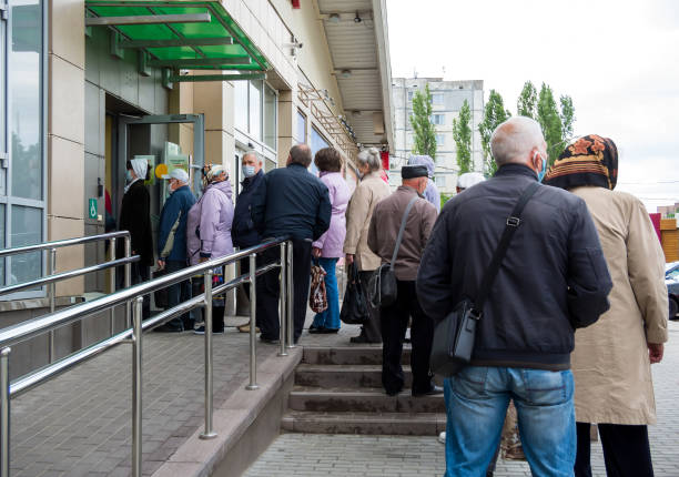 Queue of people on the street at the entrance to the building Aksioma center Russia, Voronezh - May 18, 2020: Queue of people on the street at the entrance to the building Aksioma center peace demonstration photos stock pictures, royalty-free photos & images