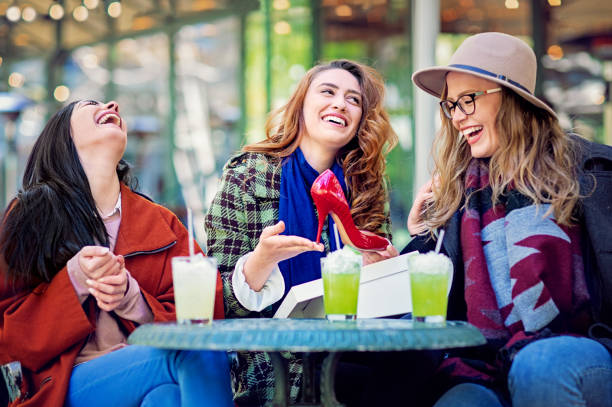 istock Girlfriends are looking their shopping and having fun in a cafe 1299594310