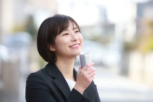 Photo of Female employee drinking a drink